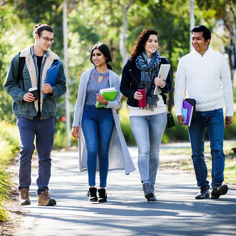 University students walking outside on campus