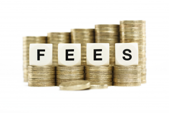 the word fees against stacks of coins